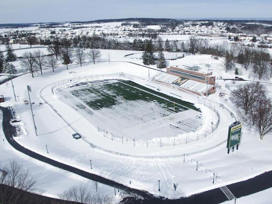Aerial photo of McDaniel College football stadium covered in snow.