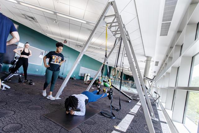 Students using pilates equipment in Merritt Fitness Center.